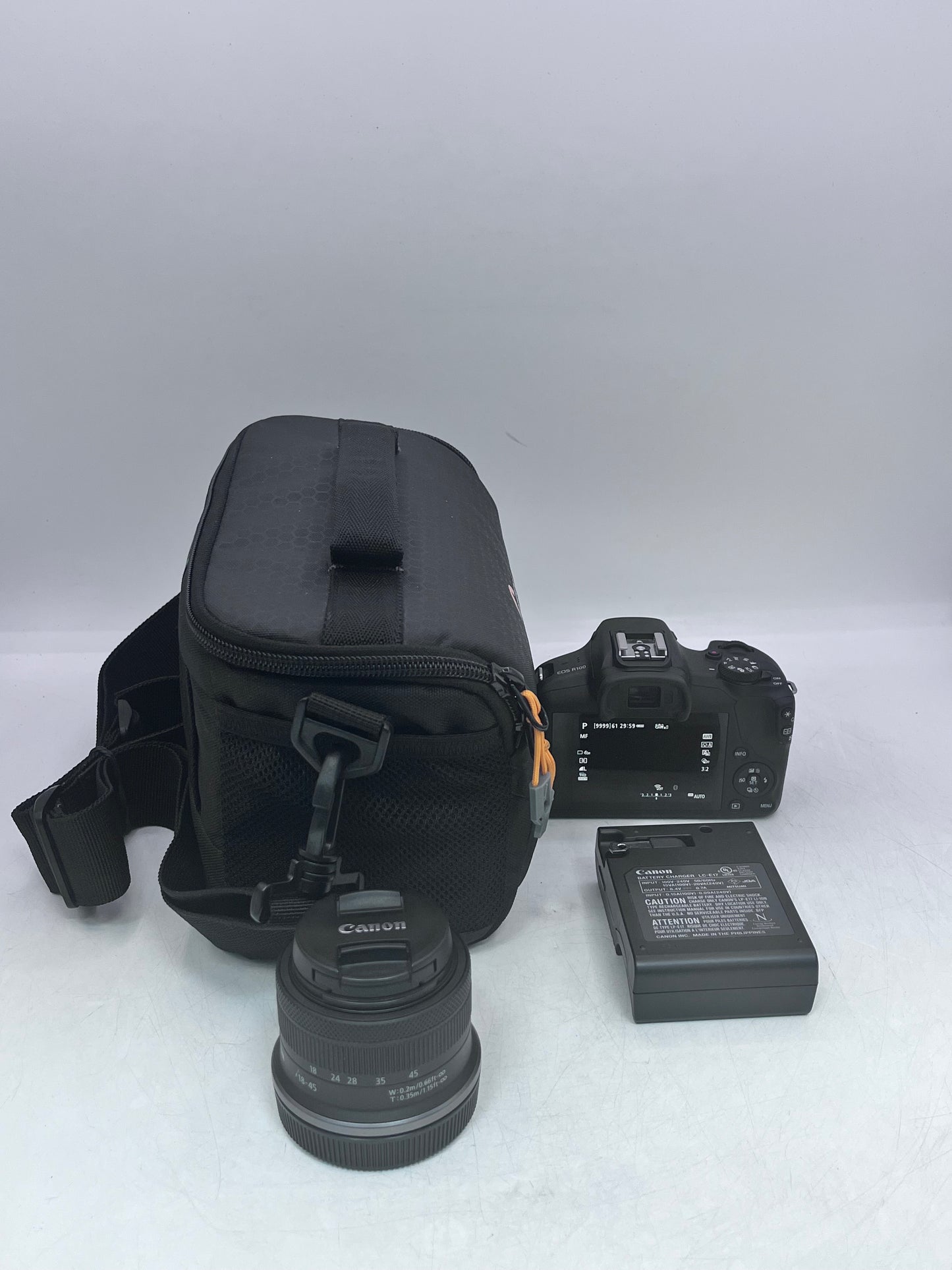 Canon EOS R100 Mirrorless Digital Camera with 18-45mm Lens with Charger and Battery Tested