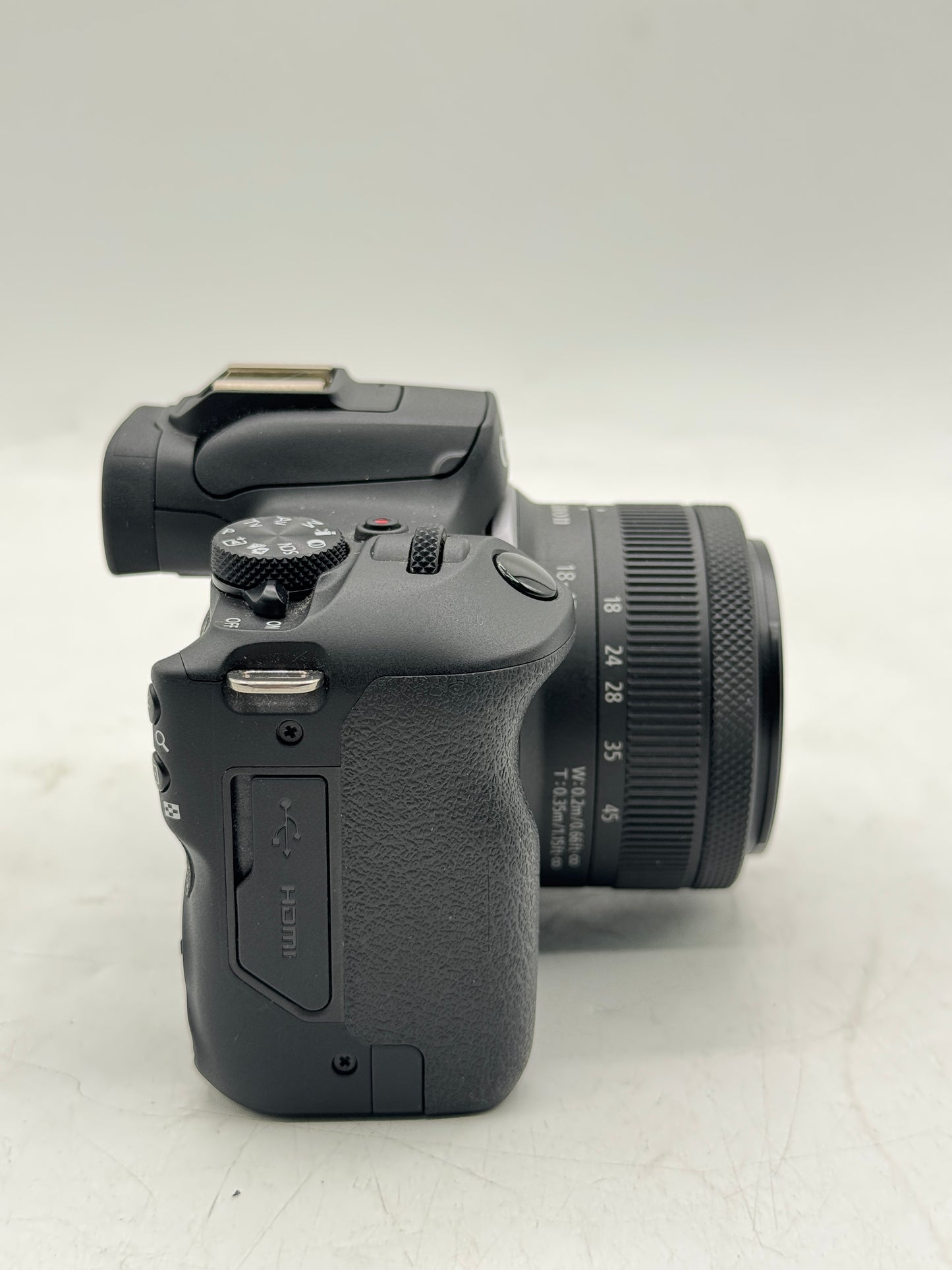 Canon EOS R100 Mirrorless 24.1 MP Camera with RF-S 18-45mm f/4.5-6.3 and Battery